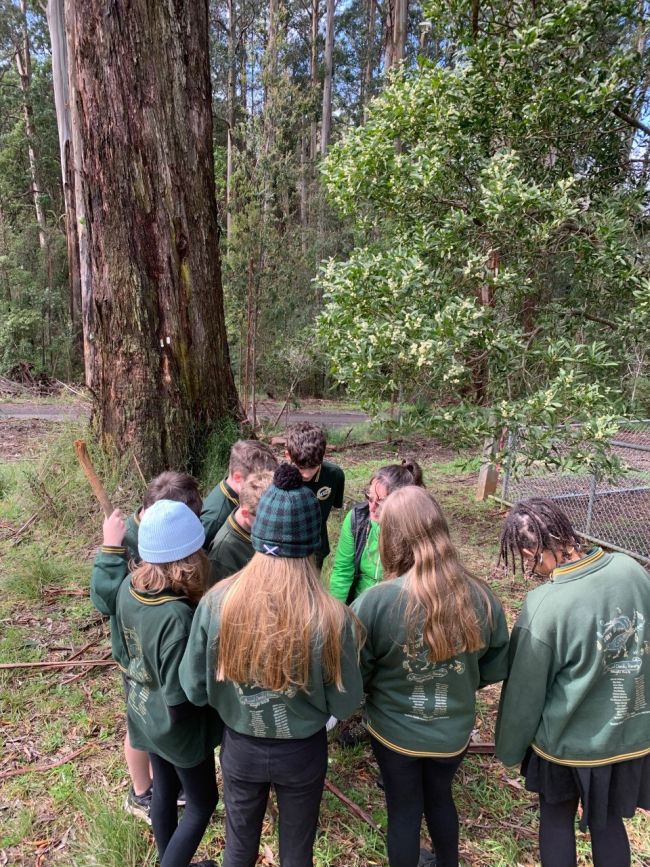 Students standing around a researcher